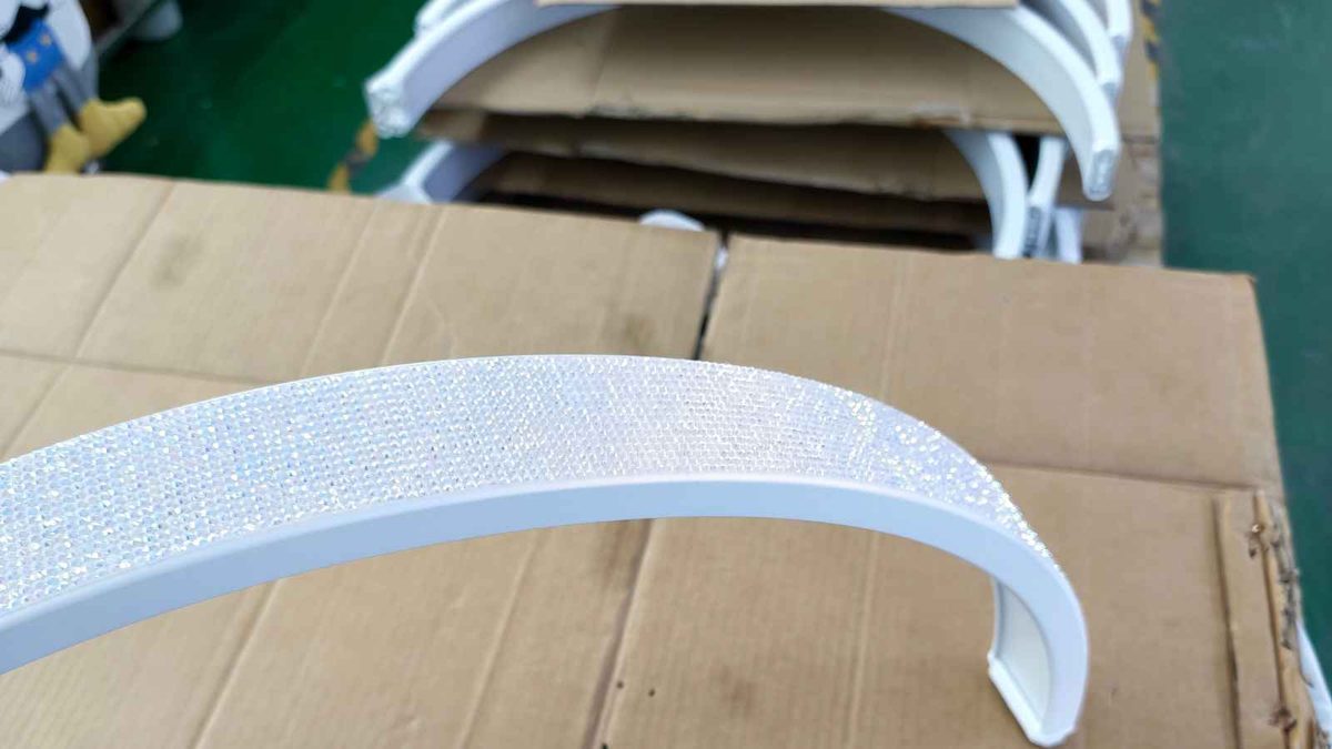 LED lamp diffuser component inspected during production quality control